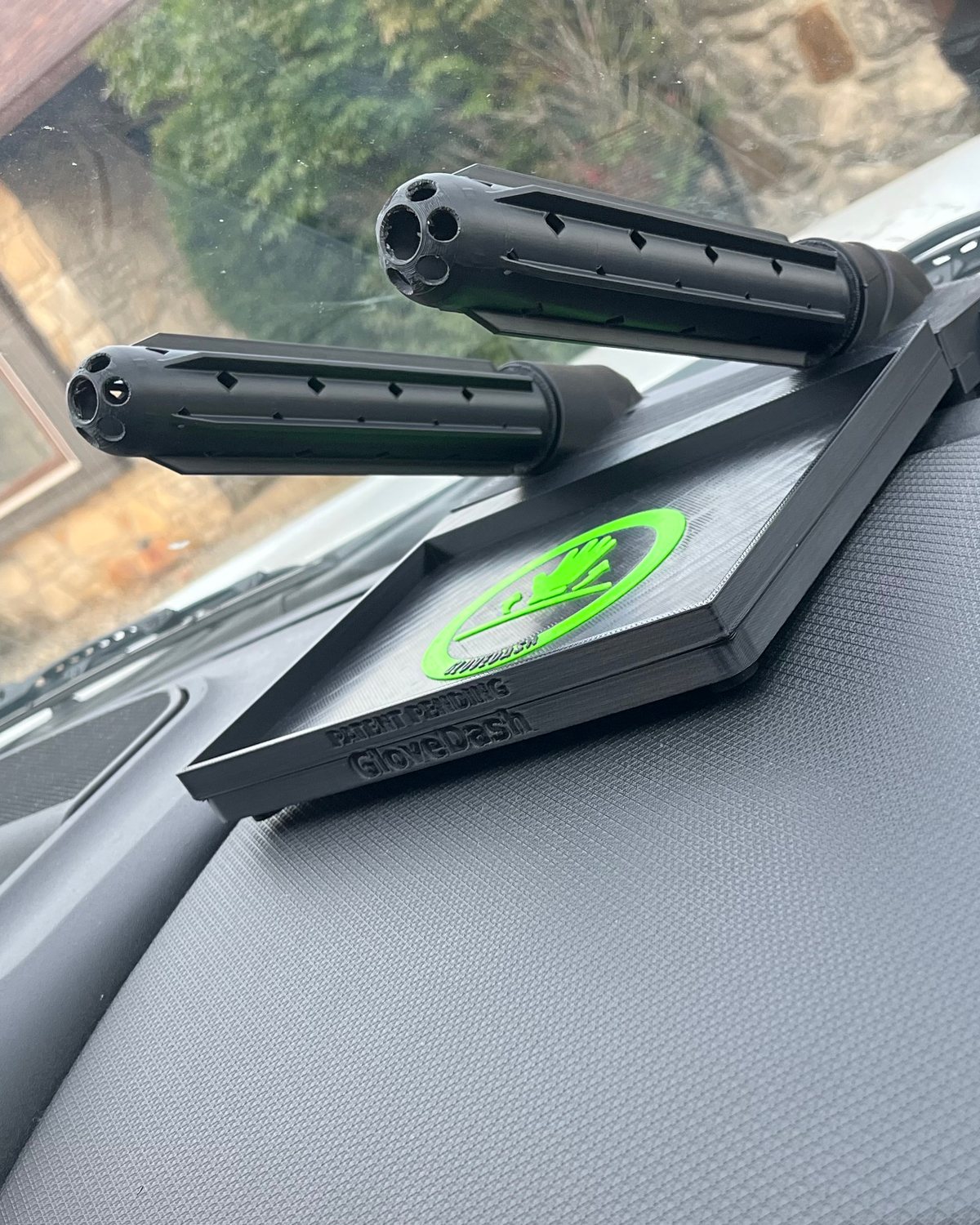 Two black GloveDash tubes mounted at an angle on the tray, vent slots running their full length and open end hubs facing the camera